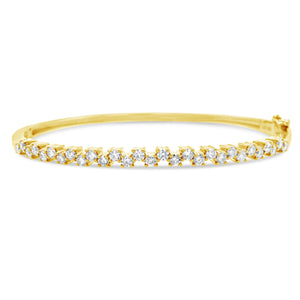 Diamond Zig-Zag Bangle Bracelet  -14K gold weighing 9.50 grams  -29 round diamonds totaling 1.00 carat