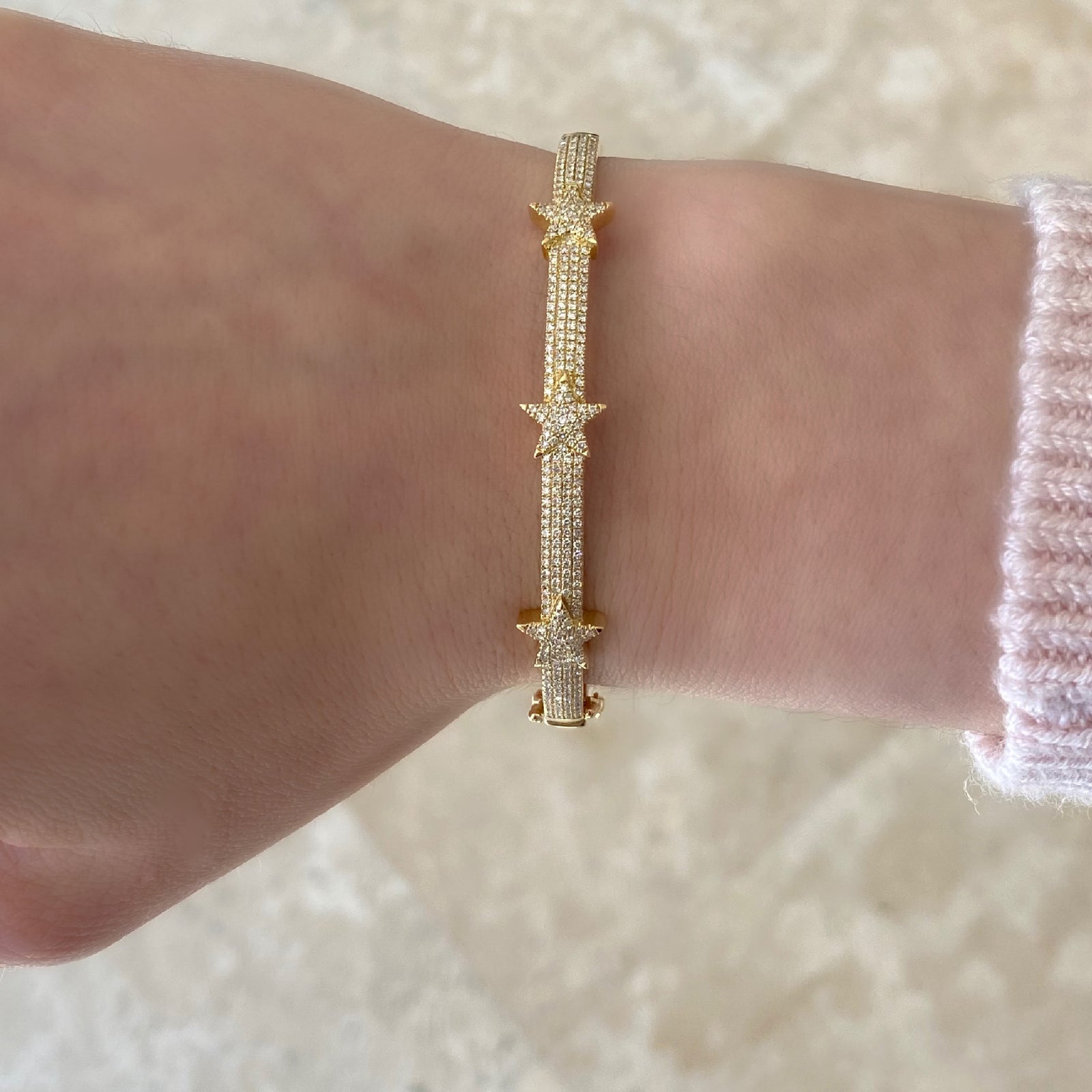 Diamond Tri-Star Bangle Bracelet  -14K gold weighing 13.48 grams  -301 round diamonds totaling 0.75 carats