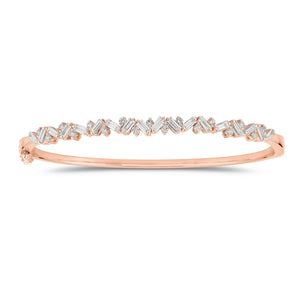 Slim Baguette and Round Diamond Bangle - 14K gold weighing 11.76 grams  - 18 slim baguettes weighing 1.04 carats  - 17 round diamonds weighing 0.37 carats