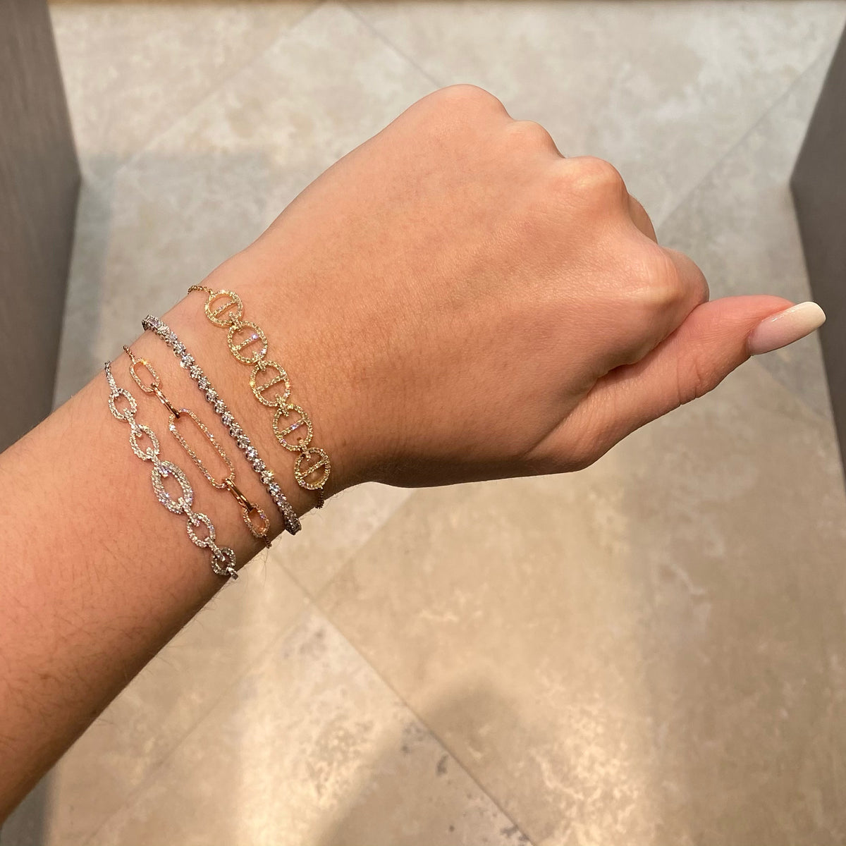 Female model wearing Diamond Adjustable Tri-Link Bracelet - 14K gold - 0.45 cts round diamonds