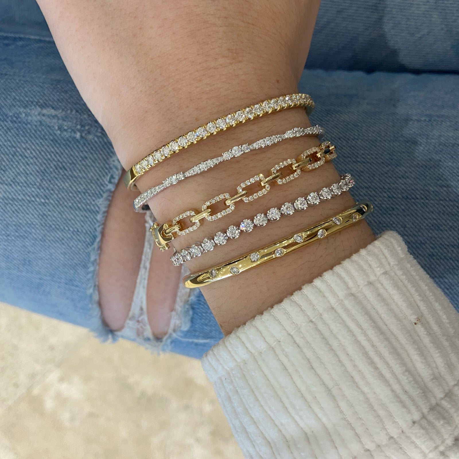 Diamond Elegance Bangle - 18K yellow gold weighing 10.79 grams   - 41 round diamonds weighing 0.95 carats