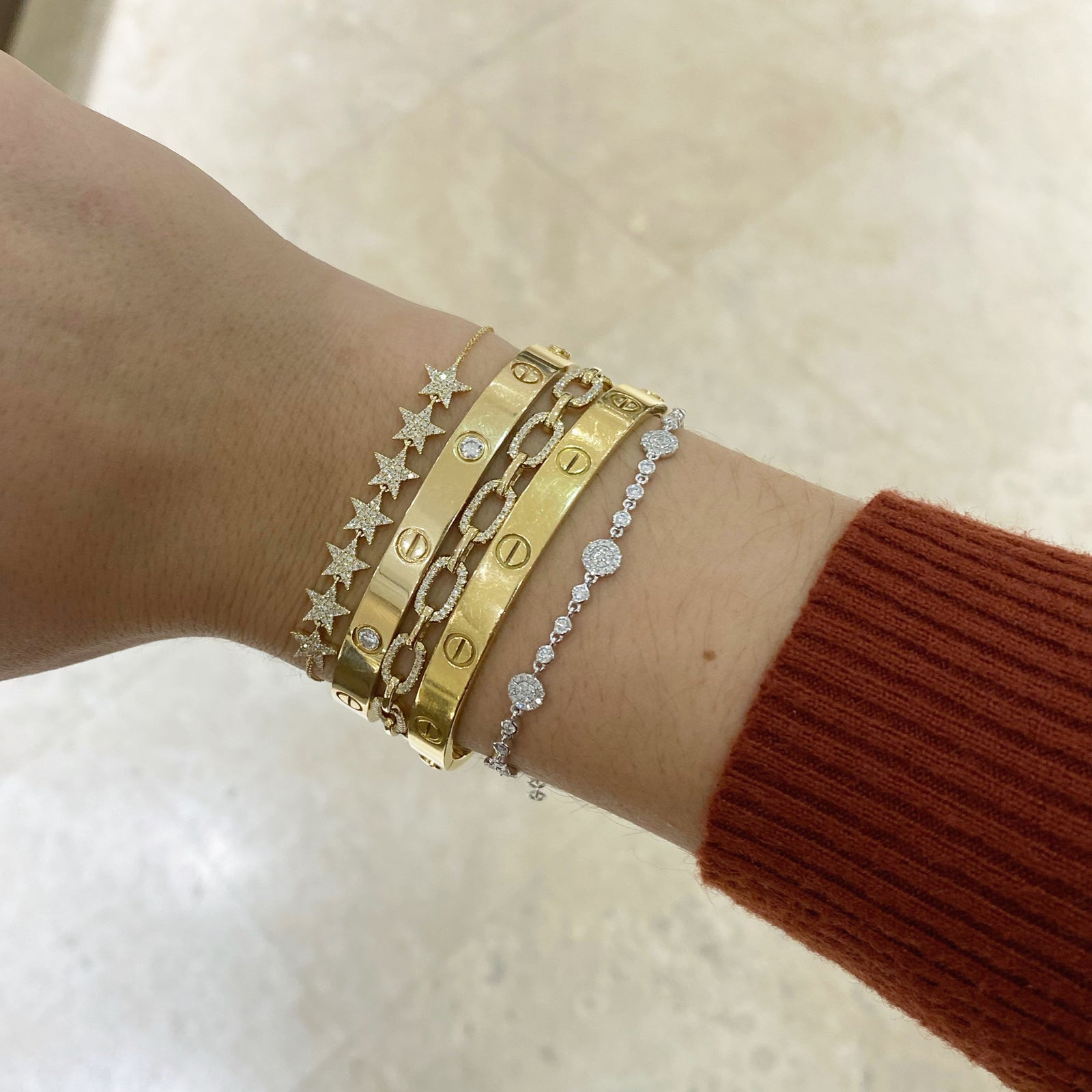 Diamond Multi-Star Bracelet - 14K yellow gold weighing 2.05 grams - 147 round diamonds totaling 0.38 carats.