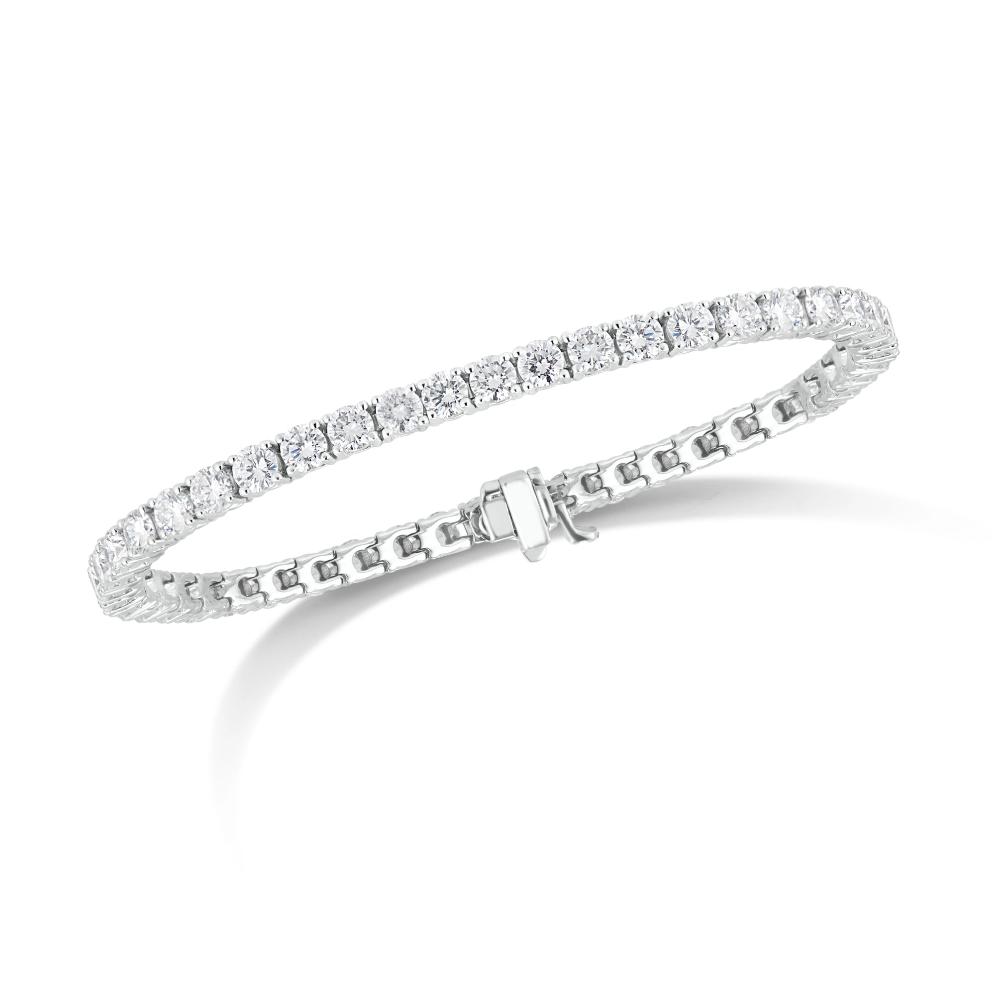 Diamond Classic Tennis Bracelet  - 14K gold weighing 13.6 grams  - 47 round diamonds totaling 8.67 carats