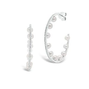 Pearl & diamond open hoop earrings -14K gold weighing 4.29 grams  -168 round diamonds totaling 0.46 carats  -20 pearls