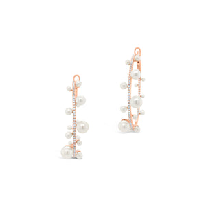 Pearl & diamond hoop earrings -14K gold weighing 8.33 grams  -146 round diamonds totaling 0.56 carats  -32 pearls