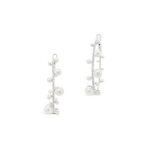 Pearl & diamond hoop earrings -14K gold weighing 8.33 grams  -146 round diamonds totaling 0.56 carats  -32 pearls