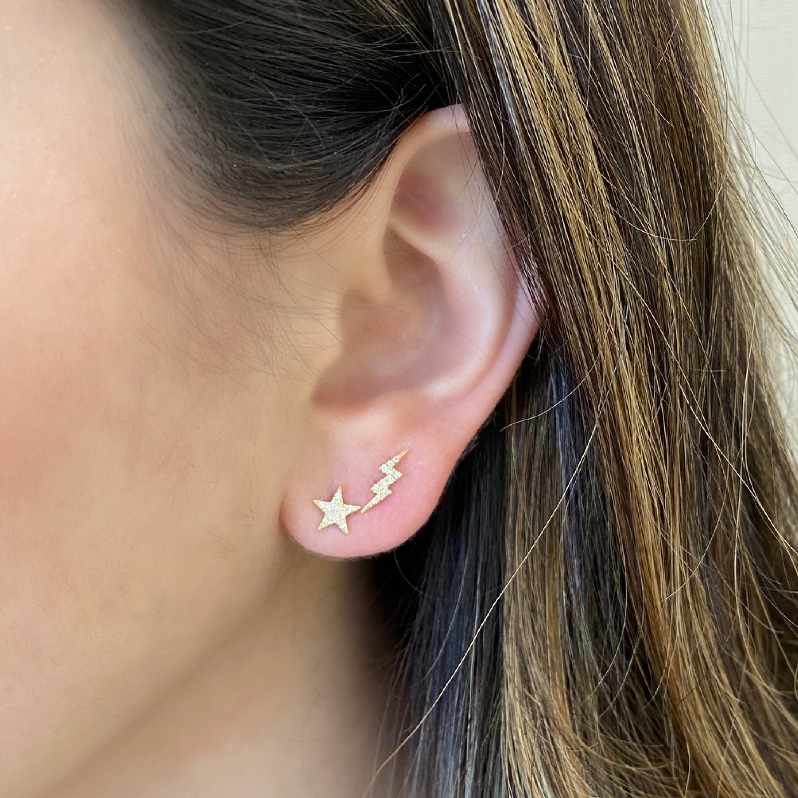 Diamond Star & Lightning Bolt Stud Earrings - 14K yellow gold weighing 0.90 grams - 23 round diamonds totaling 0.06 carats.