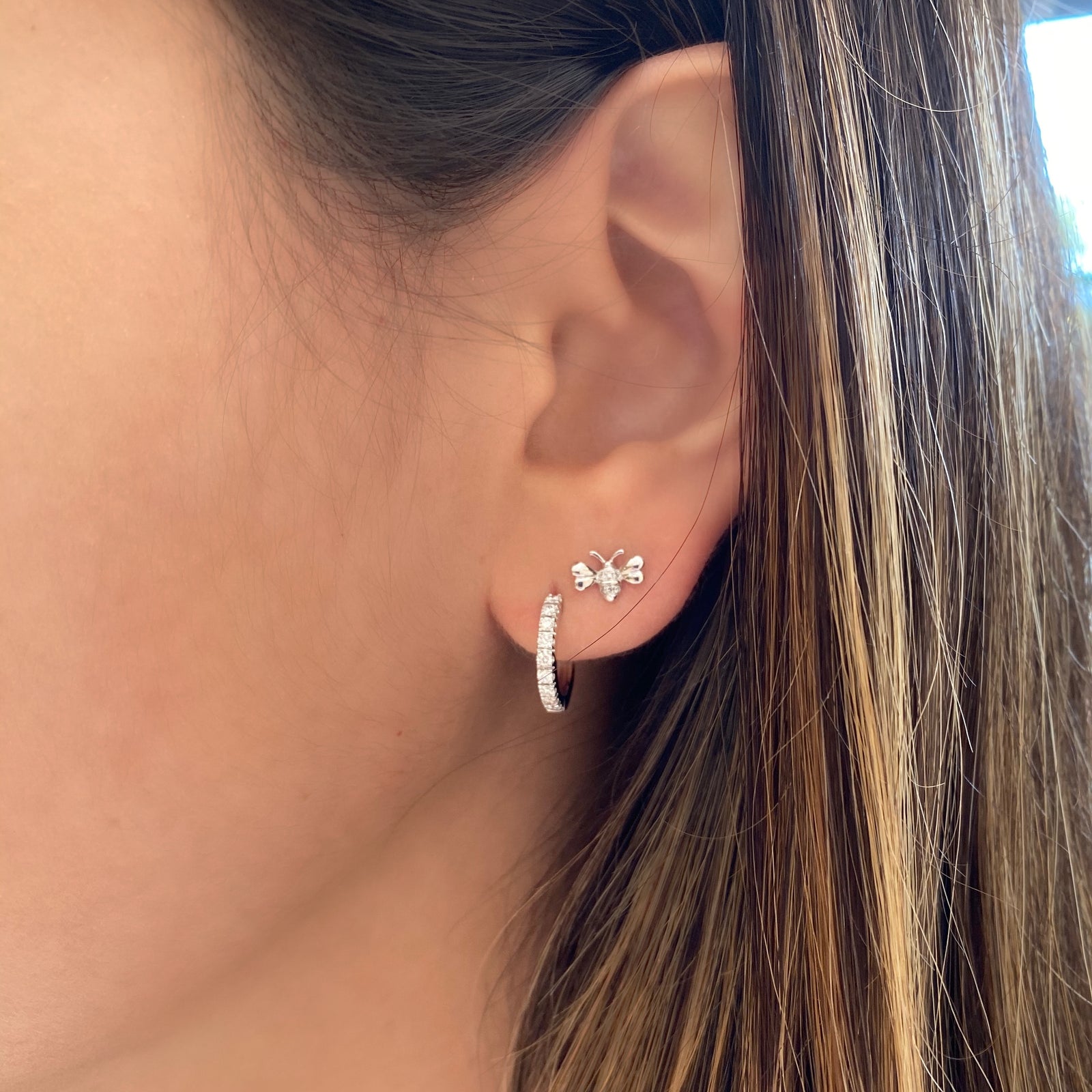 Diamond Bee Stud Earrings - 14K white gold weighing 1.03 grams - 12 round diamonds totaling 0.02 carats.