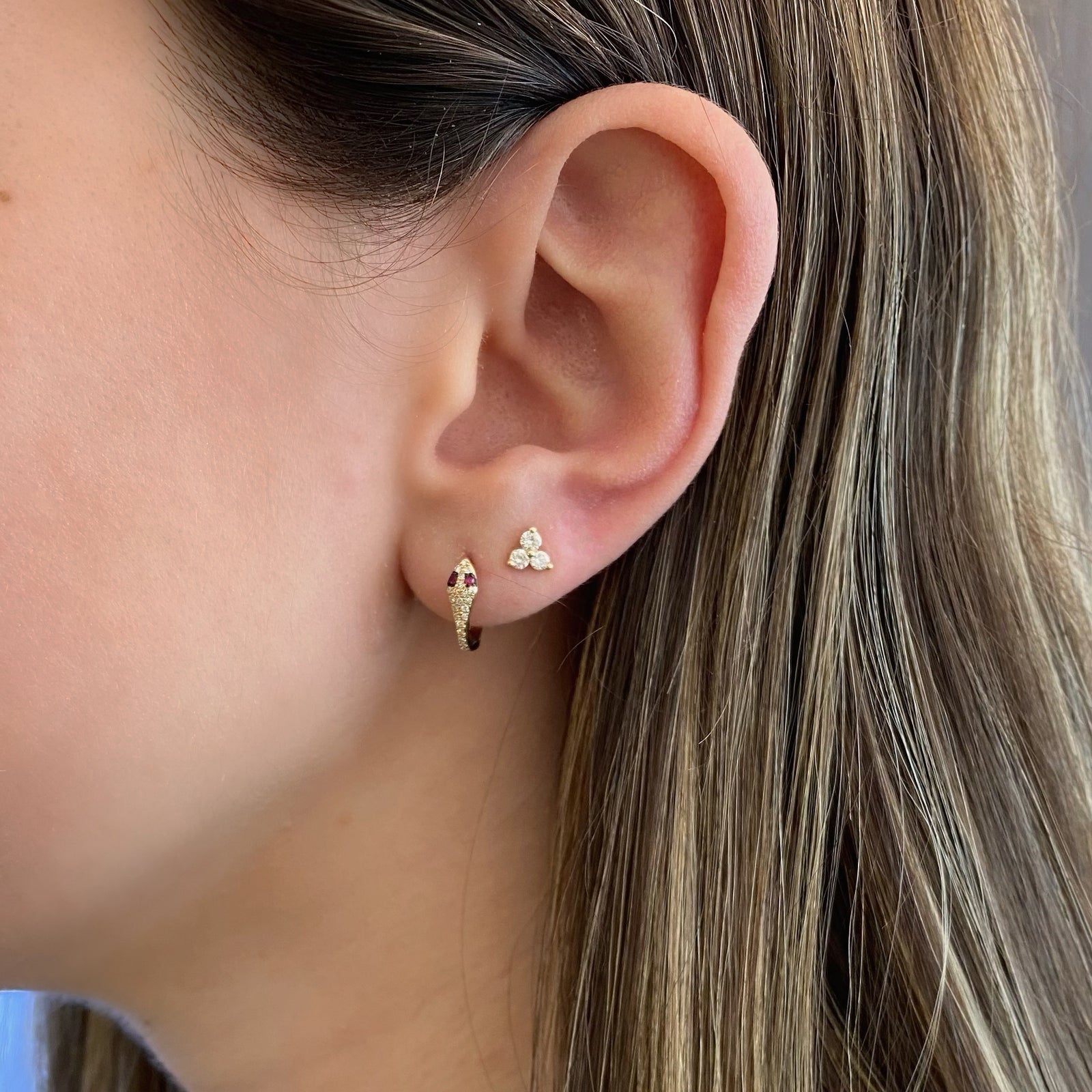 Ruby & diamond serpent huggie earrings - 14K gold weighing 1.63 grams  - 42 round diamonds totaling 0.12 carats  - 4 rubies totaling 0.05 carats