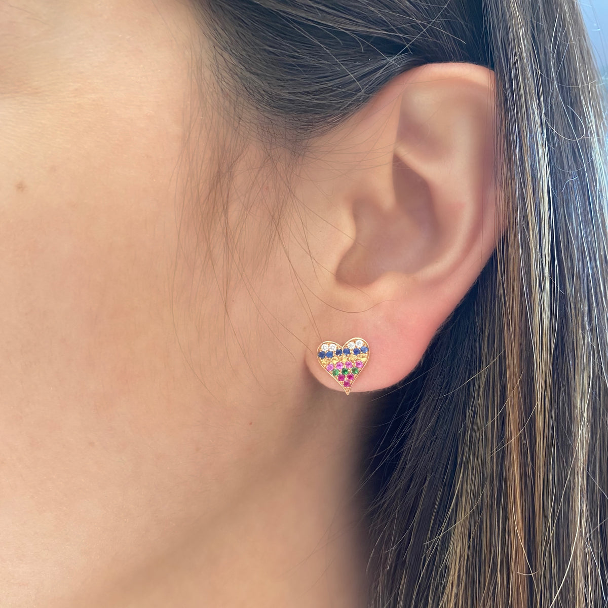 Female model wearing Rainbow Heart Stud Earrings - 14k gold weighing 1.99 grams - 0.54 total carat weight (multicolor gemstones) - 0.09 total carat weight (diamonds)