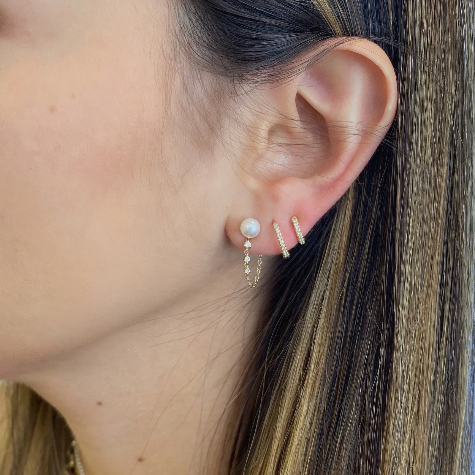 Pearl & Diamond Front-Back Earrings - 14K yellow gold weighing 1.28 grams - 6 round diamonds totaling 0.11 carats - 2 pearls