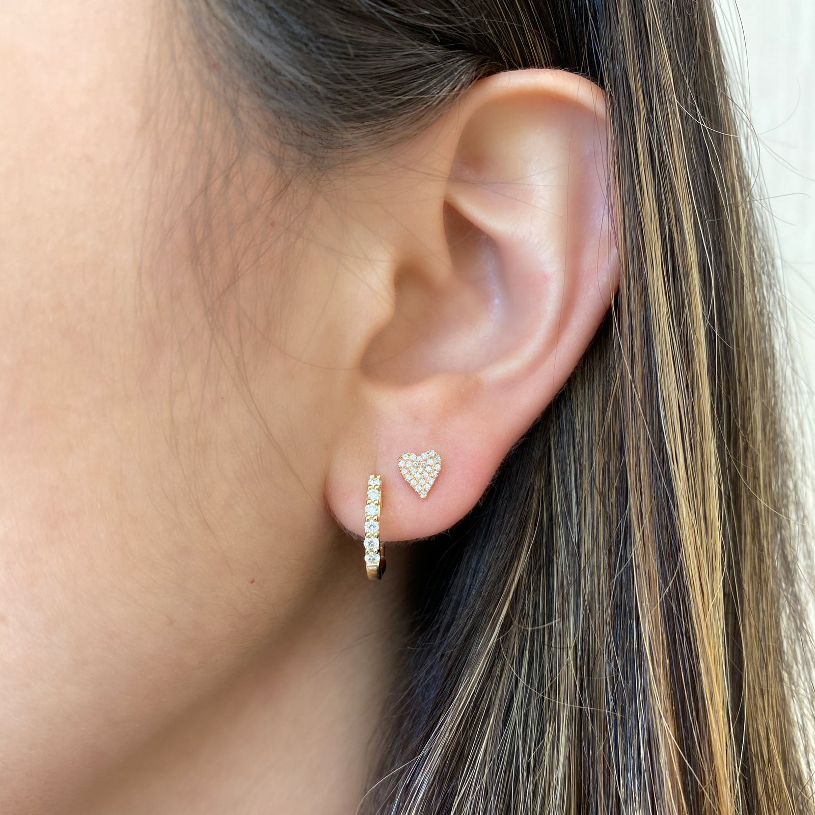 Pave Diamond Heart Stud Earrings - 14K yellow gold weighing 1.04 grams - 52 round diamonds totaling 0.12 carats.