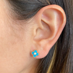 Female model wearing Turquoise Diamond Clover Stud Earrings - 14K gold weighing 1.58 grams - 2 round diamonds totaling 0.08 carats