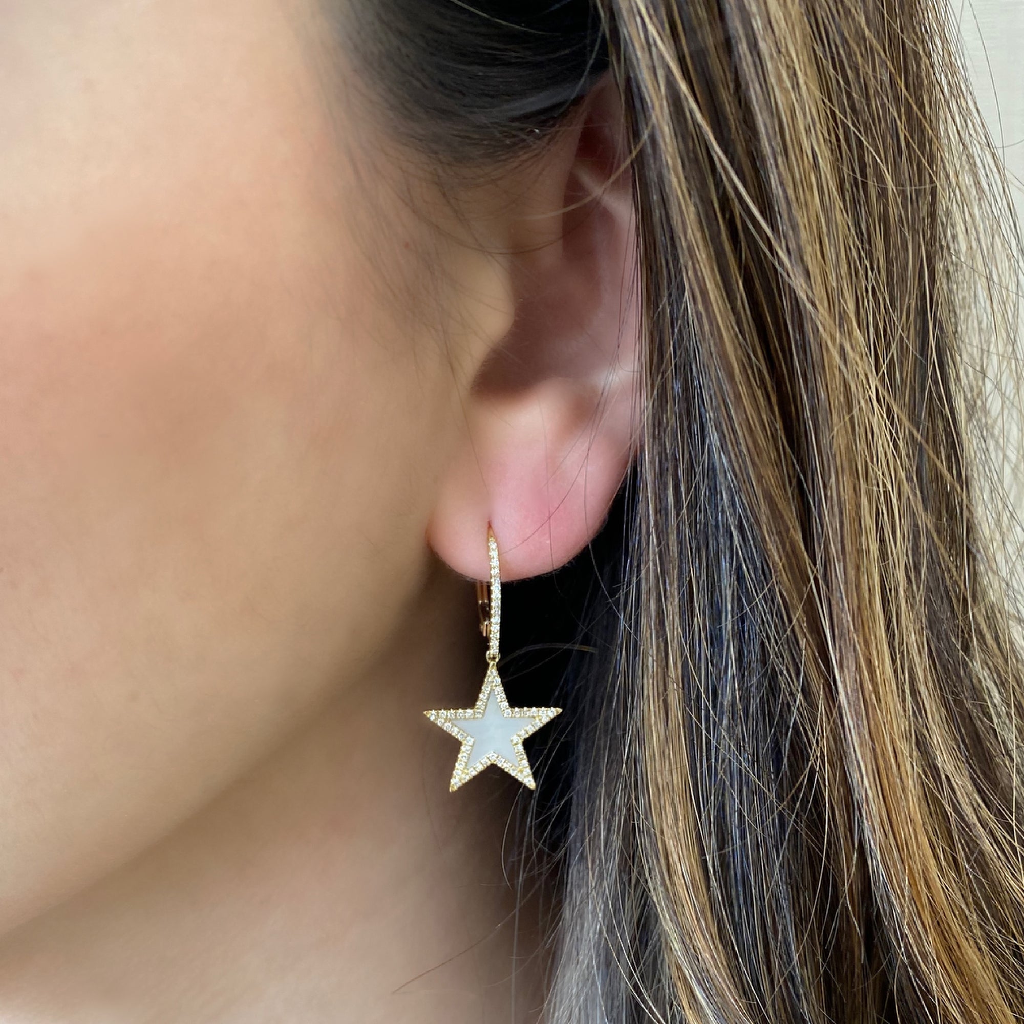 Mother of Pearl & Diamond Star Lever-Back Earrings  -14K gold weighing 3.33 grams  -128 round diamonds totaling 0.35 carats  -2 Mother of Pearl totaling 0.83 carats