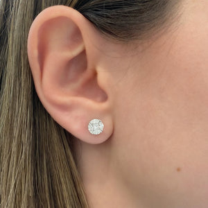 female model wearing marquise & princess-cut diamond stud earrings - 18K gold weighing 1.84 grams  - 8 marquise-shaped diamonds totaling 0.65 carats  - 2 princess-cut diamonds totaling 0.24 carats