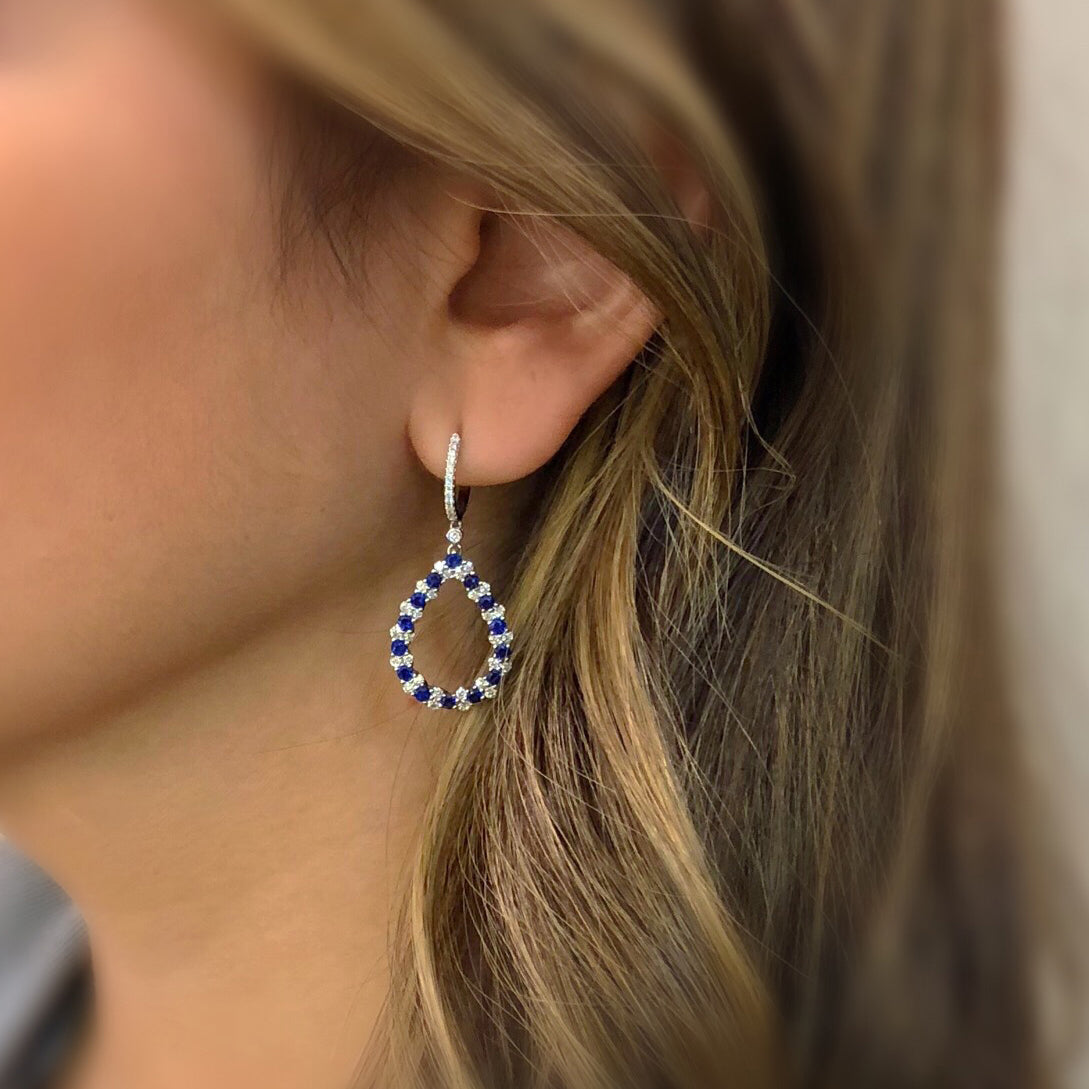 Sapphire & Diamond Teardrop Dangle Earrings  -18K gold weighing 5.05 grams  -28 sapphires totaling 1.56 carats  -82 round diamonds totaling 0.96 carats