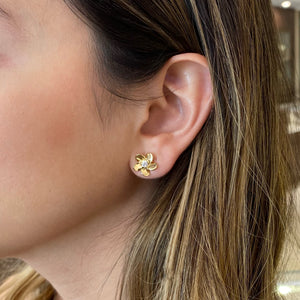 Female model wearing Diamond & gold blossom stud earrings- 14K gold  - 0.17 cts round diamonds