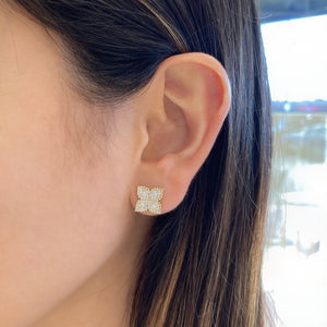 Female model wearing Diamond Flower Stud Earrings with Beaded Gold - 14K gold weighing 2.14 grams - 72 round diamonds totaling 0.36 carats