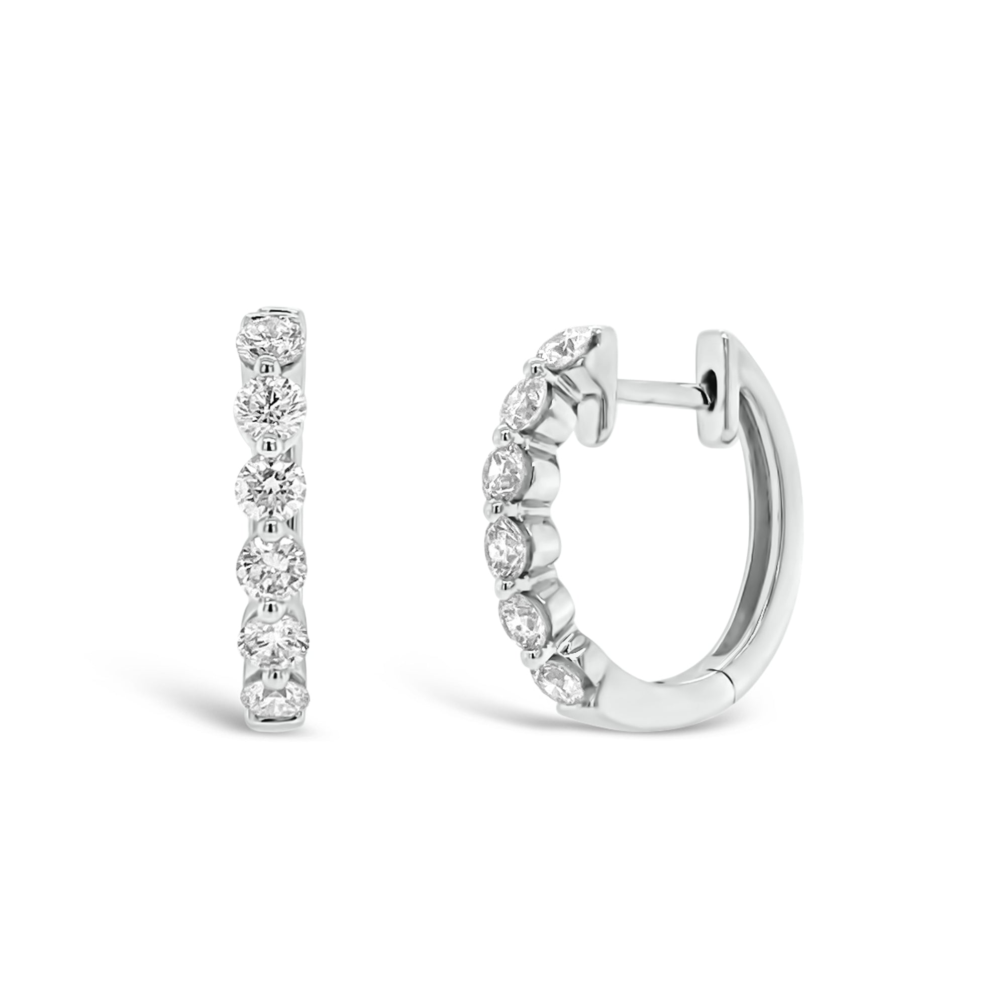 Diamond single-prong set huggie earrings  - 18K gold weighing 3.01 grams  - 12 round diamonds totaling 0.78 carats