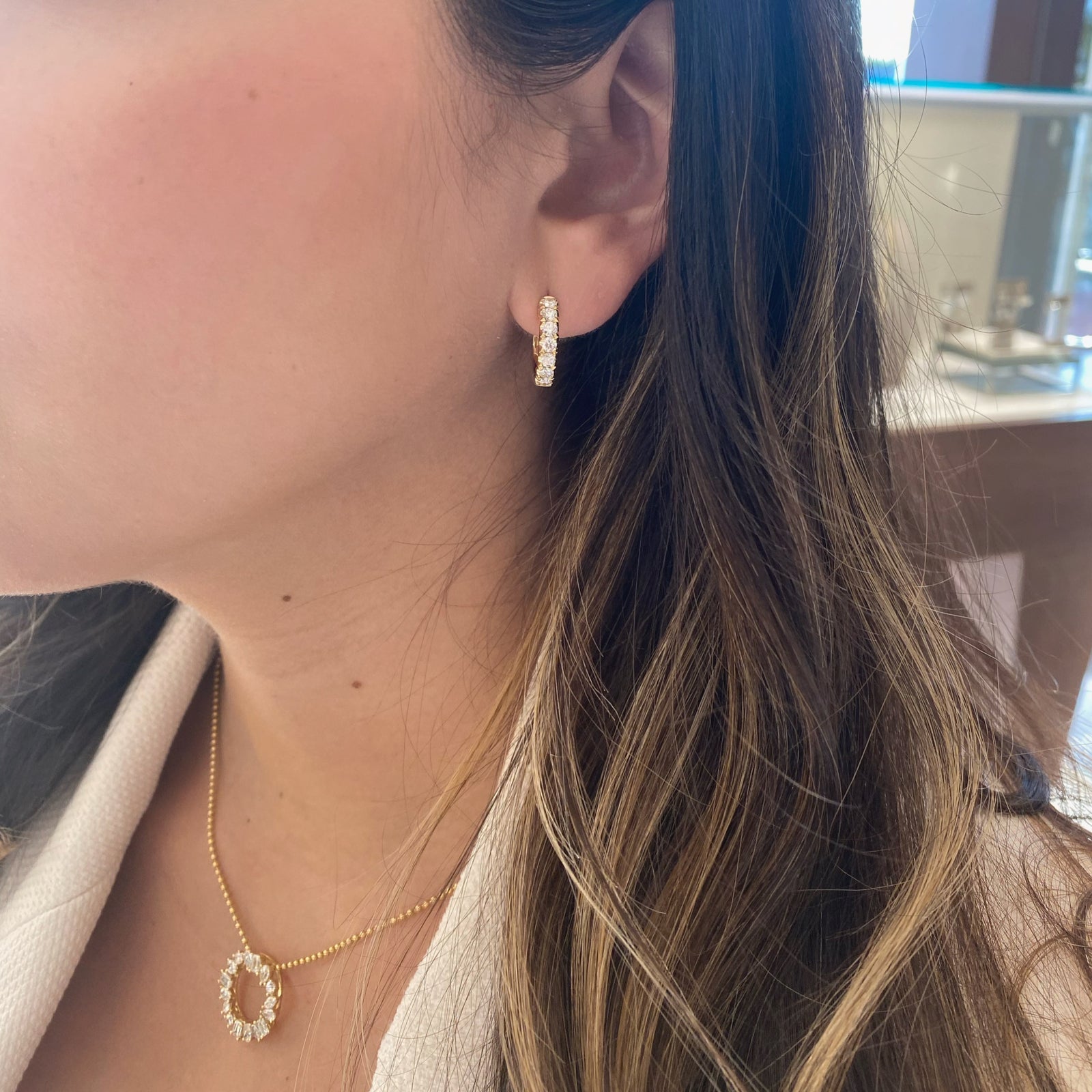 14K gold weighing 4.35 grams featuring 14 round diamonds weighing 0.90 carats 0.90 ct Huggie Earrings | Nuha Jewelers