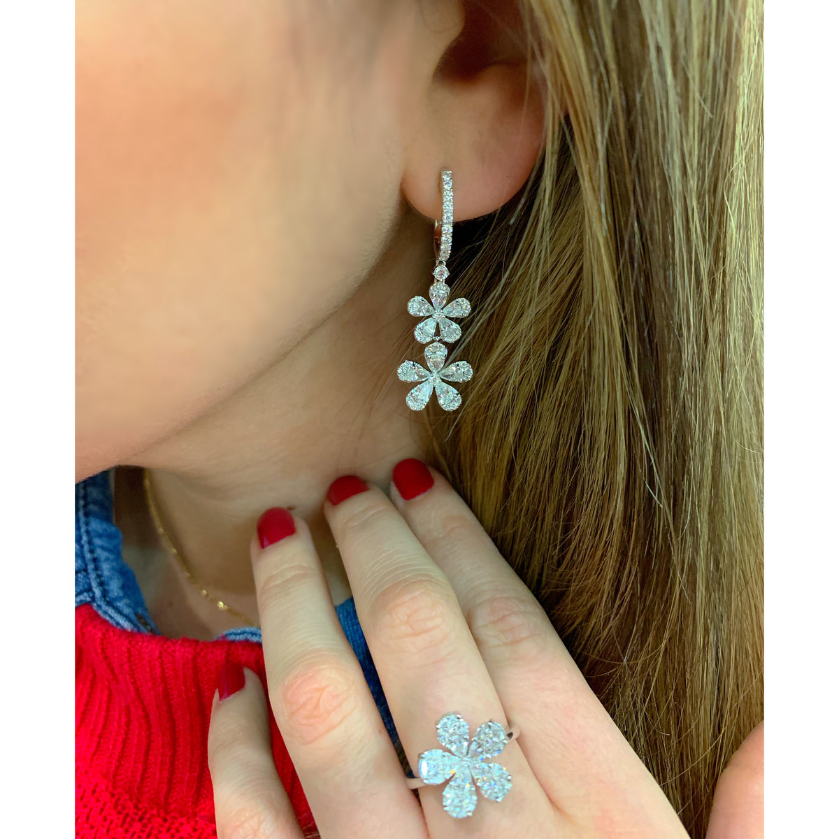 Female Model Wearing Diamond Double Flower Drop Earrings  -18K gold weighing 7.02 grams  -86 round diamonds totaling 0.87 carats  -20 Pear shape prong-set diamonds totaling 2.33 carats 