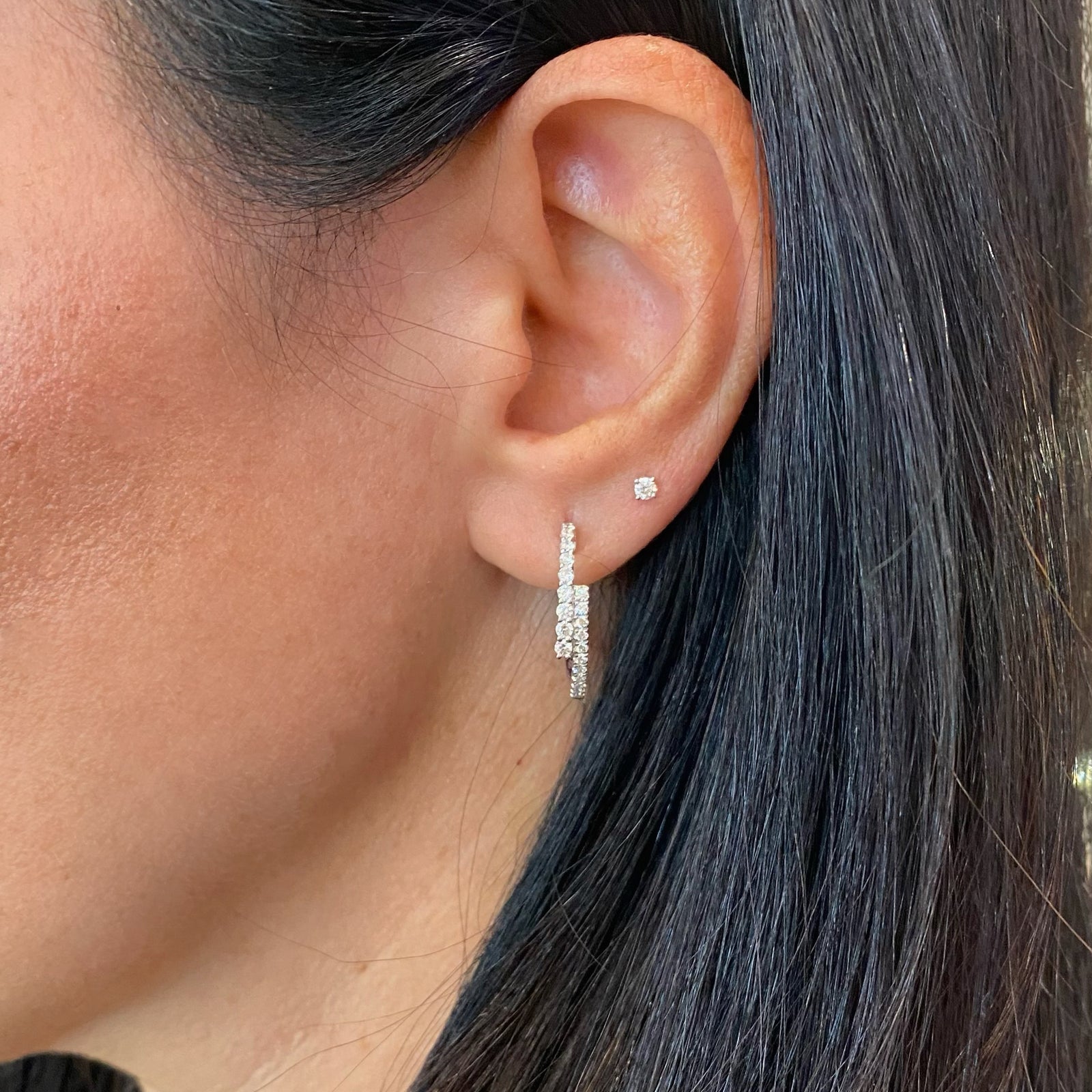 Diamond two-tone crossover hoop earrings -18K gold weighing 4.57 grams  -40 round diamonds totaling 0.57 carats