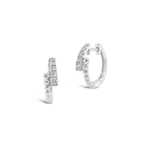 Diamond & Beaded Gold Crossover Huggie Earrings -18K white gold weighing 2.87 grams  -10 round diamonds totaling 0.19 carats