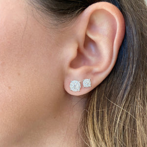 Female Model Wearing 1.13 ct Halo Diamond Stud Earrings - 18K gold weighing 1.88 grams  - 2 round diamonds weighing 0.58 carats  - 18 round diamonds weighing 0.55 carats