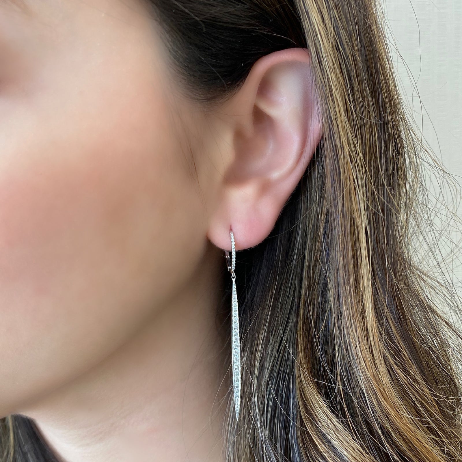 Diamond Dagger Lever-Back Earrings     -14K gold weighing 3.19 grams     -78 round pave-set diamonds totaling 0.67 carats.     Earring size measures 2.5” long, 2.60 millimeters width.