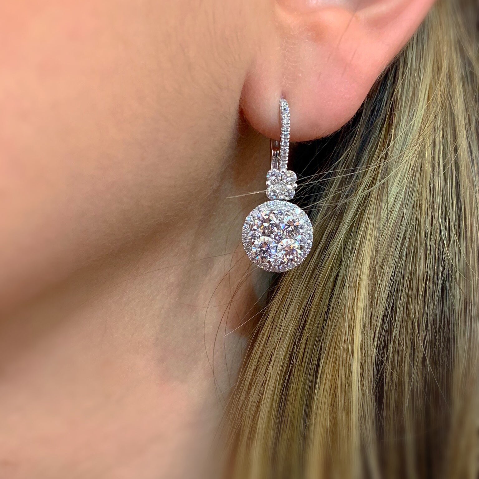 Diamond Cluster Lever-Back Earrings  -18K gold weighing 5.52 grams  -92 round diamonds totaling 3.15 carats  -Lever back