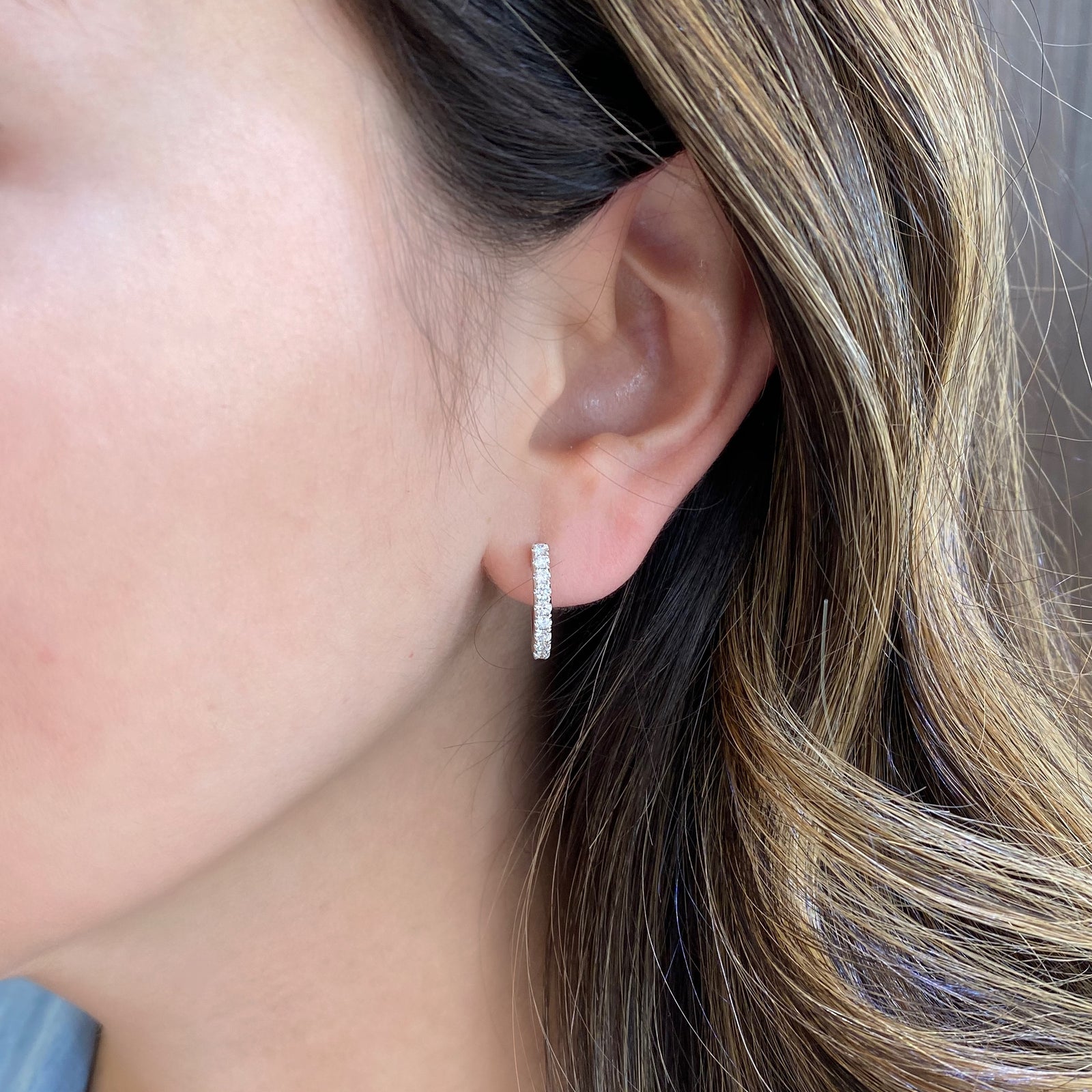 Diamond small huggie earrings  - 14K gold weighing 3.08 grams  - 18 round diamonds totaling 0.45 carats