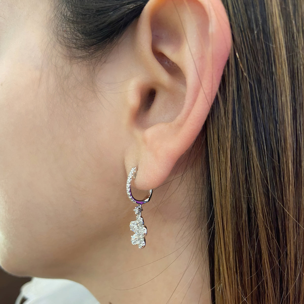 Diamond Flower Huggie Earrings  18k gold, 4.01 grams, 72 round diamonds .57 carats, 10 pear shape prong set diamonds 1.01 carats.