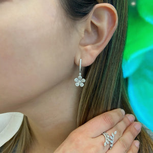 Female Model Wearing Diamond Flower Huggie Earrings  18k gold, 4.01 grams, 72 round diamonds .57 carats, 10 pear shape prong set diamonds 1.01 carats.