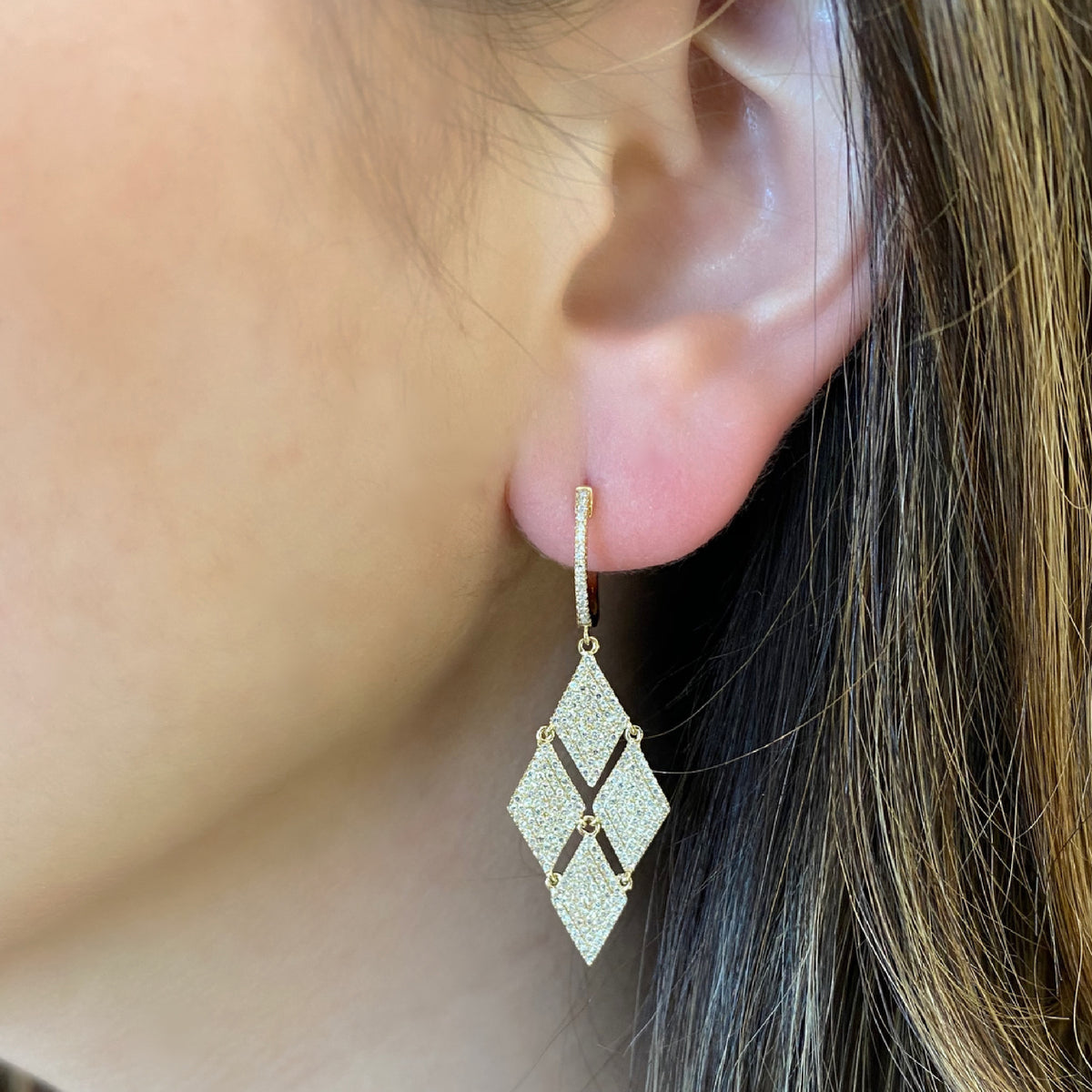 Female Model Wearing Diamond Fashion Dangle Earrings  -14K gold weighing 4.81 grams  -504 round pave-set diamonds totaling 1.09 carats