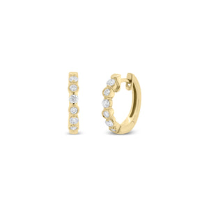 Diamond huggie earrings and bezels & milgrain detail -18K gold weighing 2.95 grams  -12 round diamonds totaling 0.32 carats