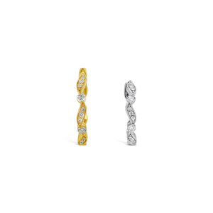 Large Diamond Ribbon Huggie Earrings -18K yellow gold weighing 3.28 grams -22 round diamonds totaling 0.20 carats