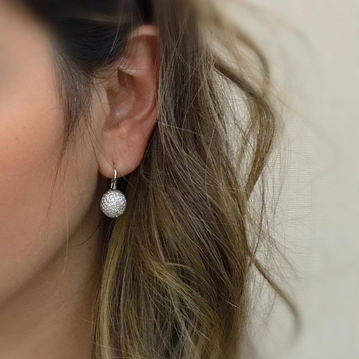 Diamond Domed Lever-Back Earrings.  -18K white gold weighing 6.42 grams  -190 round pave set diamonds totaling 2.23 carats