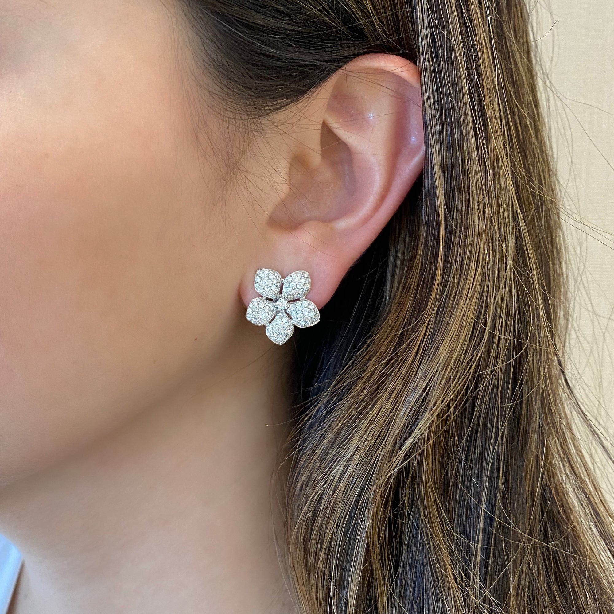 pave-set diamond flower clip earrings 18k gold, 4.03 grams, 204 round brilliant cut pave-set diamonds 1.67 carats.  Earring size 17 millimeters.