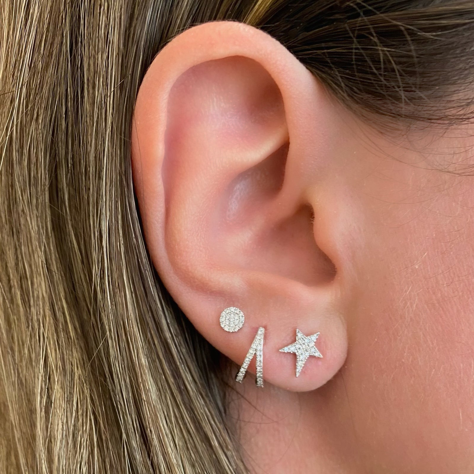 Diamond Asymmetrical Star Stud Earrings - 14K gold weighing 1.25 grams - 32 round diamonds totaling 0.09 carats