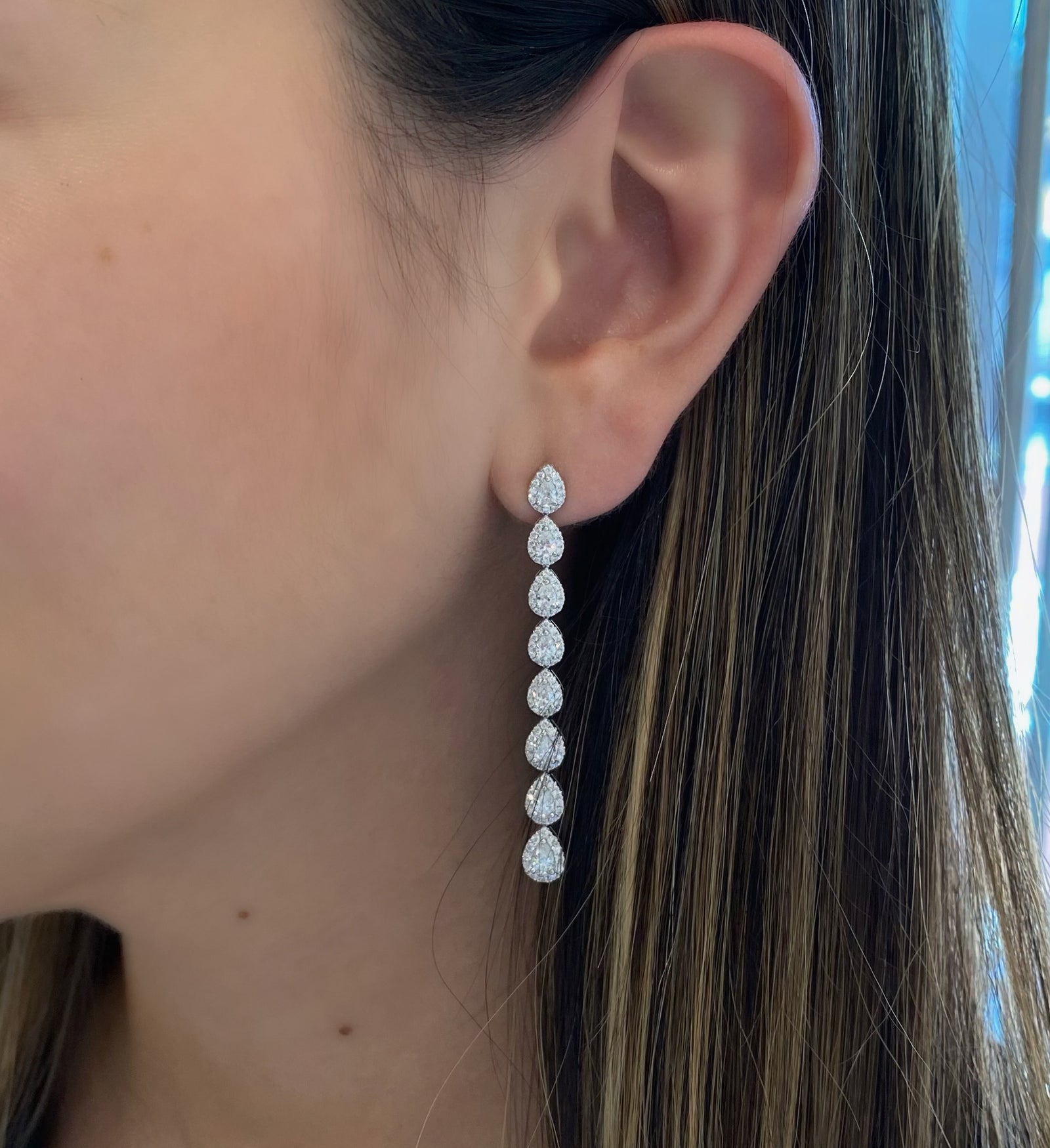 Diamond Teardrop Long Dangle Earrings  - 18K gold weighing 8.24 grams  - 192 round diamonds totaling 1.05 carats  - 16 pear-shaped diamonds totaling 1.85 carats