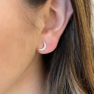 Female model wearing Celestial Diamond Stud Earrings -14K gold weighing 1.39 grams -27 round diamonds weighing 0.18 carats