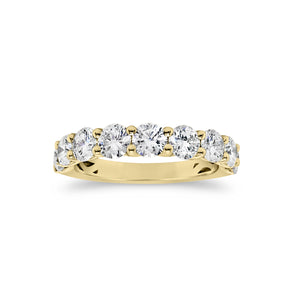 Shared Prong-Set Diamond Wedding Band  -18k gold weighing 3.29 grams  -9 round shared prong-set diamonds 1.68 carats