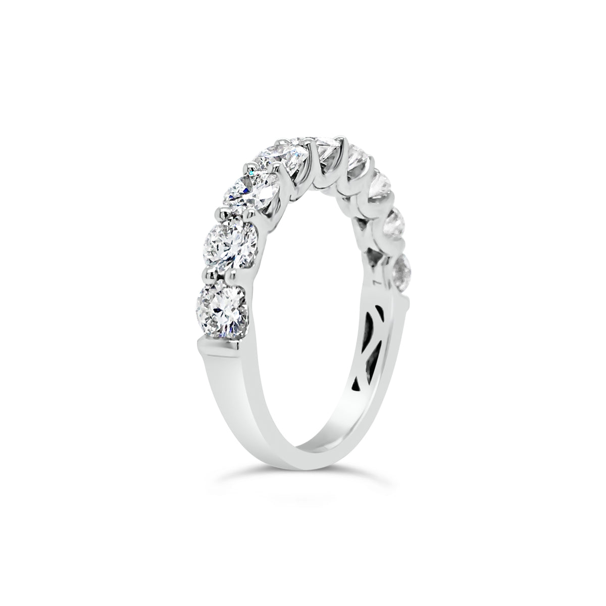 Shared Prong-Set Diamond Wedding Band  -18k gold weighing 3.29 grams  -9 round shared prong-set diamonds 1.68 carats