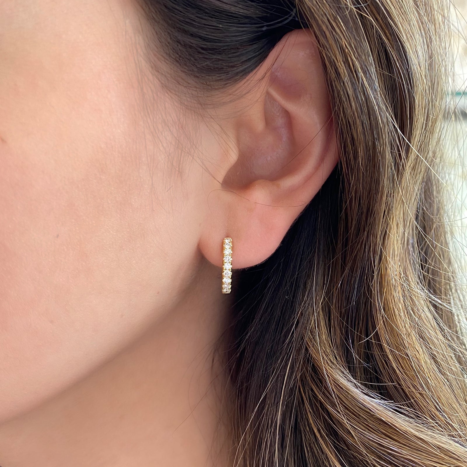 Small diamond huggie earrings -18k gold weighing 3.76 grams  -18 round diamonds weighing .38 carats