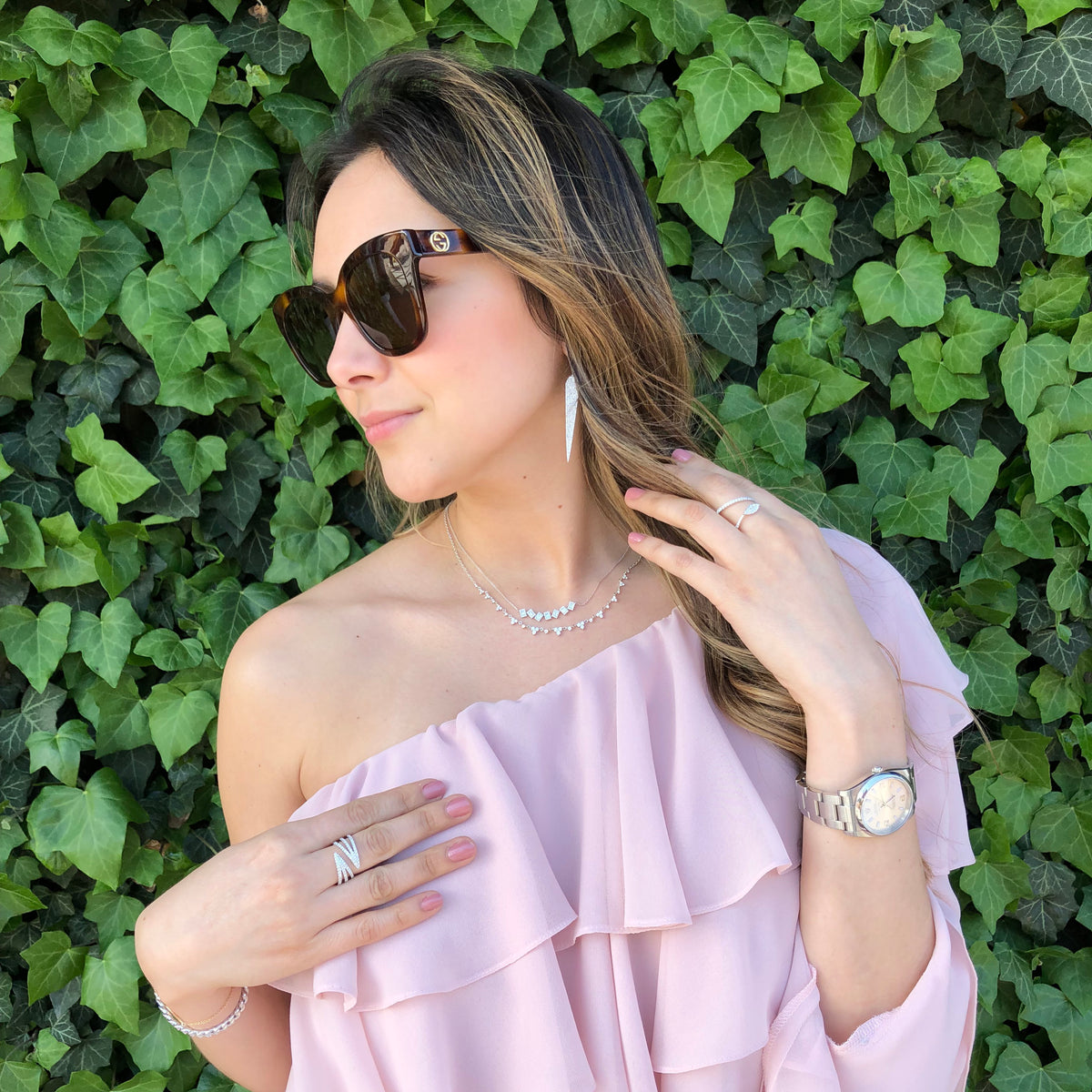 Female Model Wearing Diamond Triple Coil Ring  -14K gold weighing 4.91 grams  -84 round diamonds totaling 0.69 carats