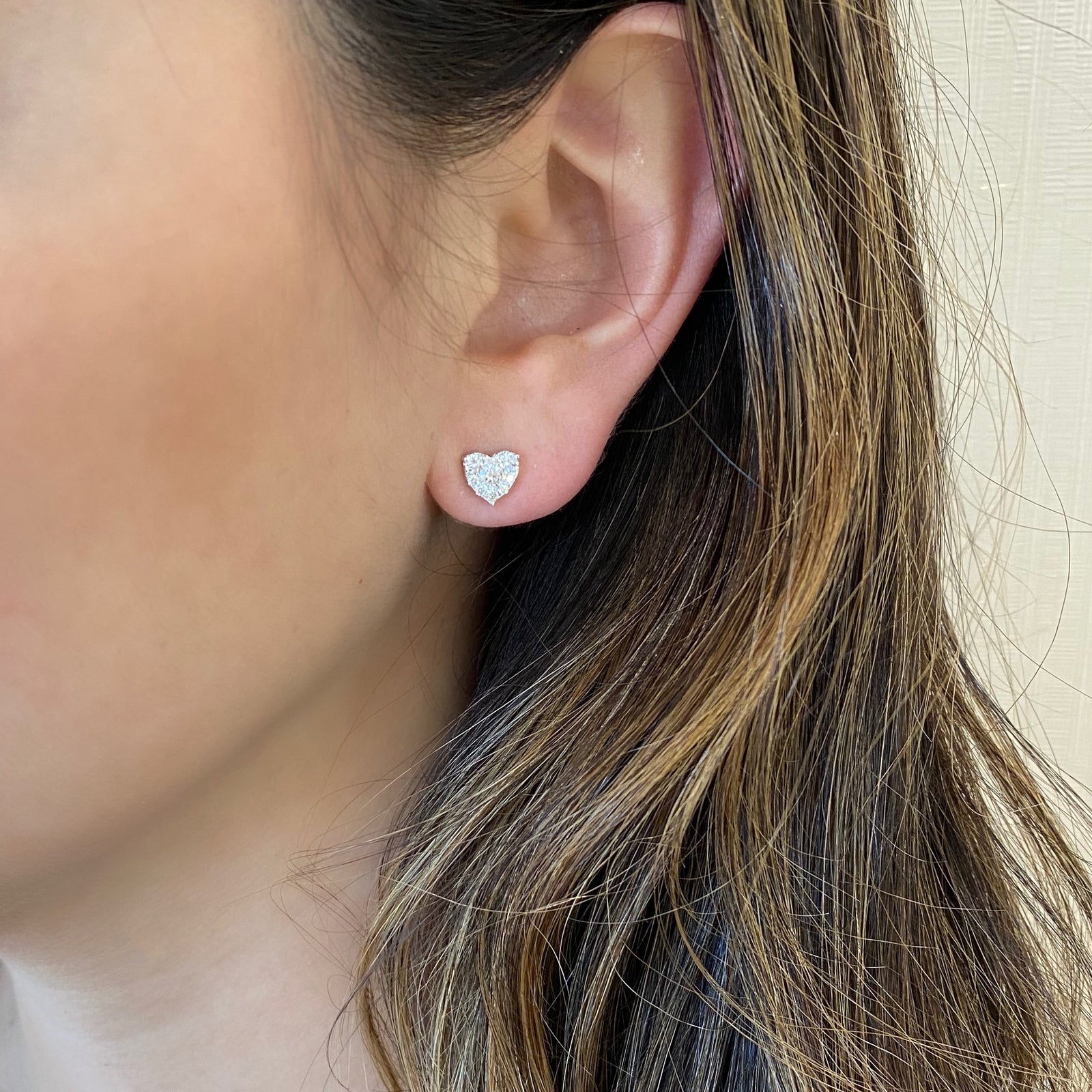 diamond heart stud earrings - 18K gold weighing 1.98 grams  - 18 round diamonds totaling 0.33 carats  - 2 round diamonds totaling 0.23 carats