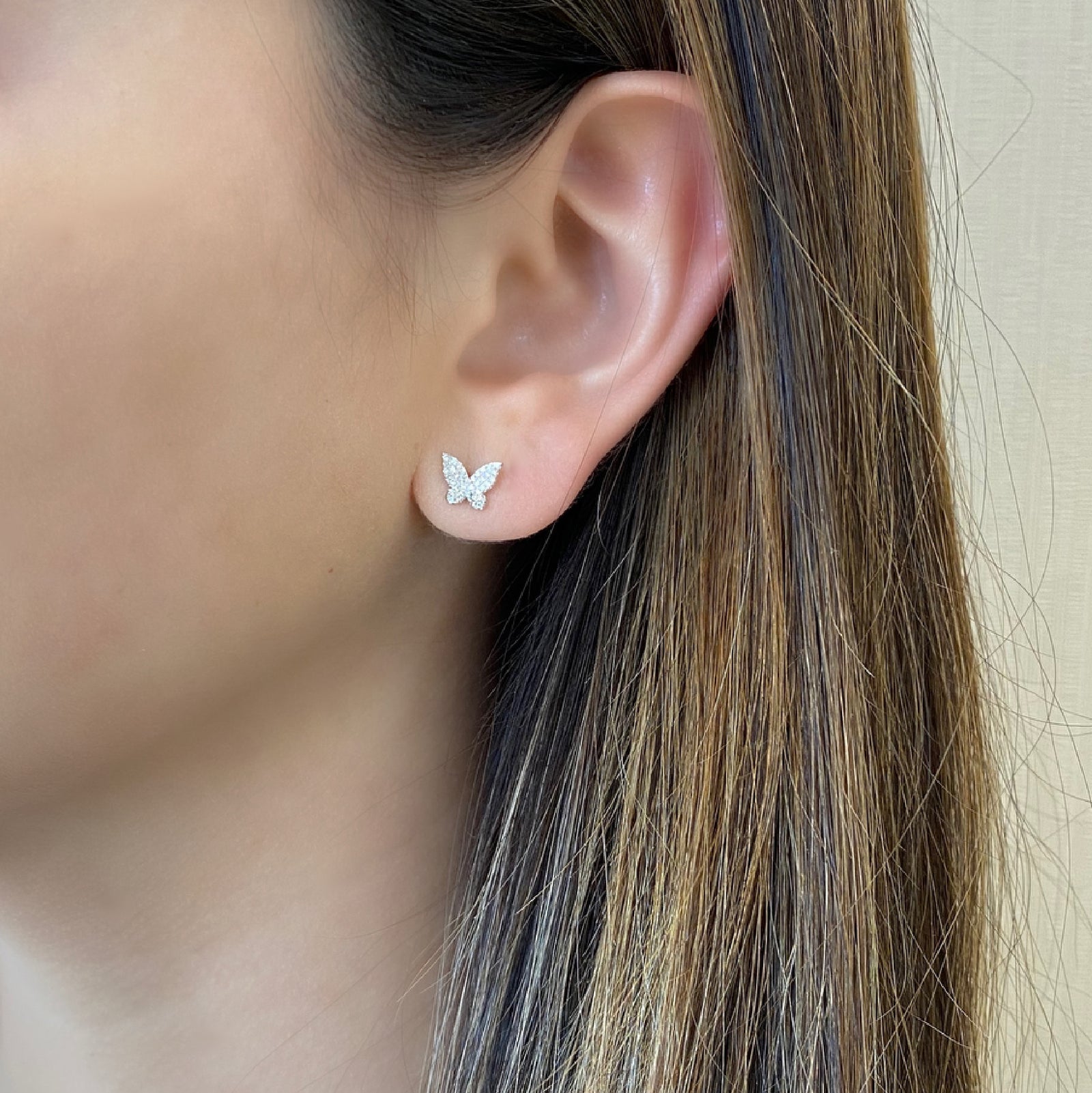Pave Diamond Butterfly Stud Earrings - 14K white gold weighing 1.12 grams - 72 round diamonds totaling 0.16 carats.