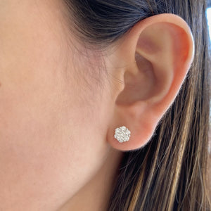 female model wearing cluster diamond stud earrings - 18k Gold weighing 1.80 grams - 14 round diamonds weighing .84 carats
