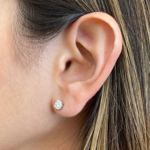Female model wearing 0.38 ct Round Diamond Cluster Earrings - 18K gold weighing 1.36 grams - 2 round diamonds totaling 0.20 carats - 18 round diamonds totaling 0.18 carats