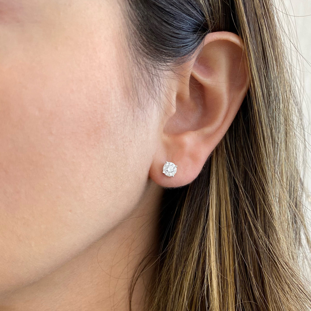 Female model wearing 0.38 ct Round Diamond Cluster Earrings - 18K gold weighing 1.36 grams - 2 round diamonds totaling 0.20 carats - 18 round diamonds totaling 0.18 carats